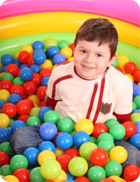 Child in a colorful ball pit